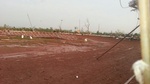 front straightaway looking at turns 1 and 2. massive debris wreck in infield is remains of main grandstand